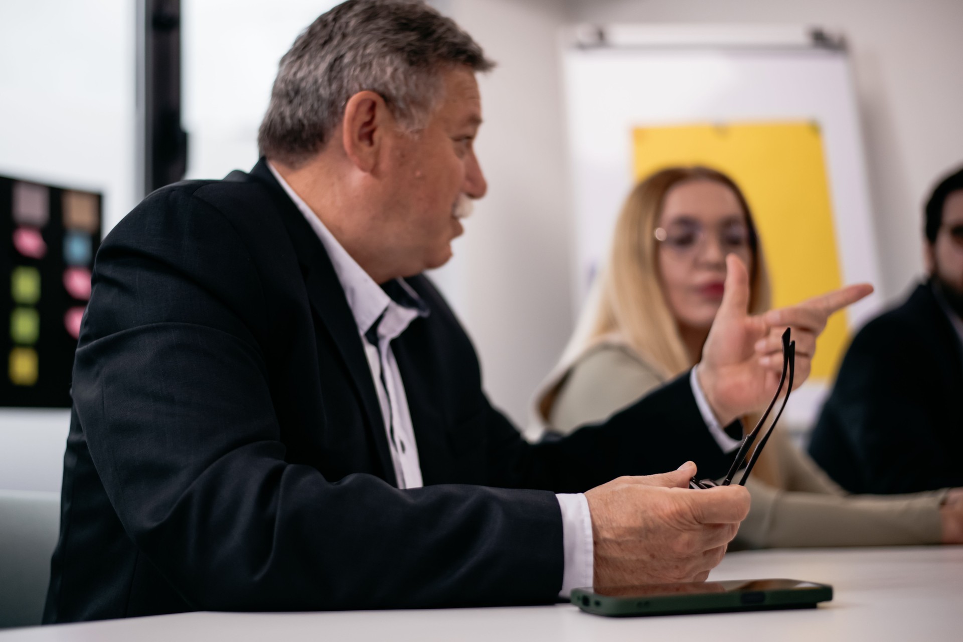 Business professionals discussing and collaborating in a modern office environment